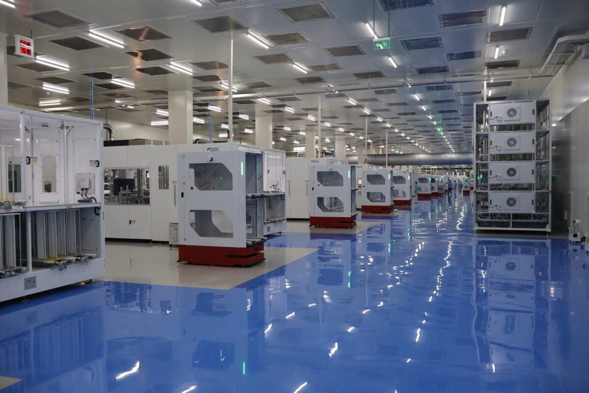 A rows of high-efficiency solar panels installed in a utility-scale solar farm setting