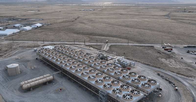 Fervo Energy geothermal drilling rig operations in a remote desert landscape.