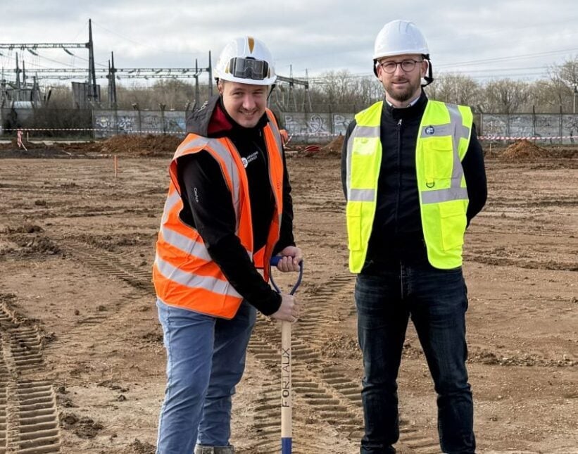 Aerial view of a large-scale industrial battery energy storage system construction site in France
