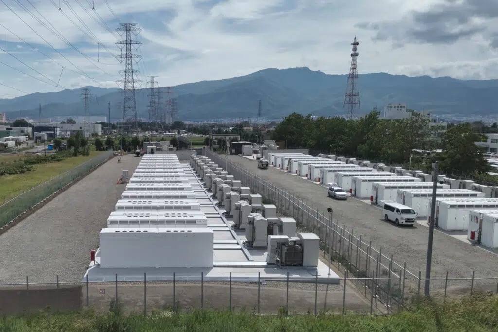 Large-scale lithium-ion battery storage containers installed at a utility-scale solar project site