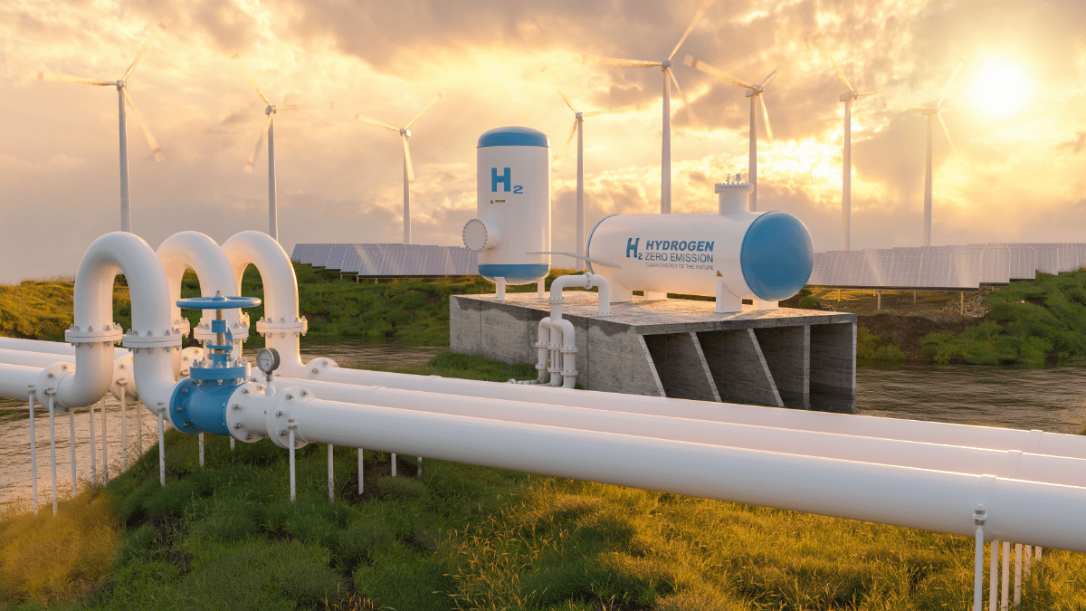 Aerial view of a green hydrogen production facility powered by a surrounding solar PV array in Europe.