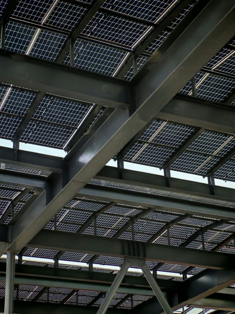 A modern solar photovoltaic pergola installation in a municipal parking lot in Spain